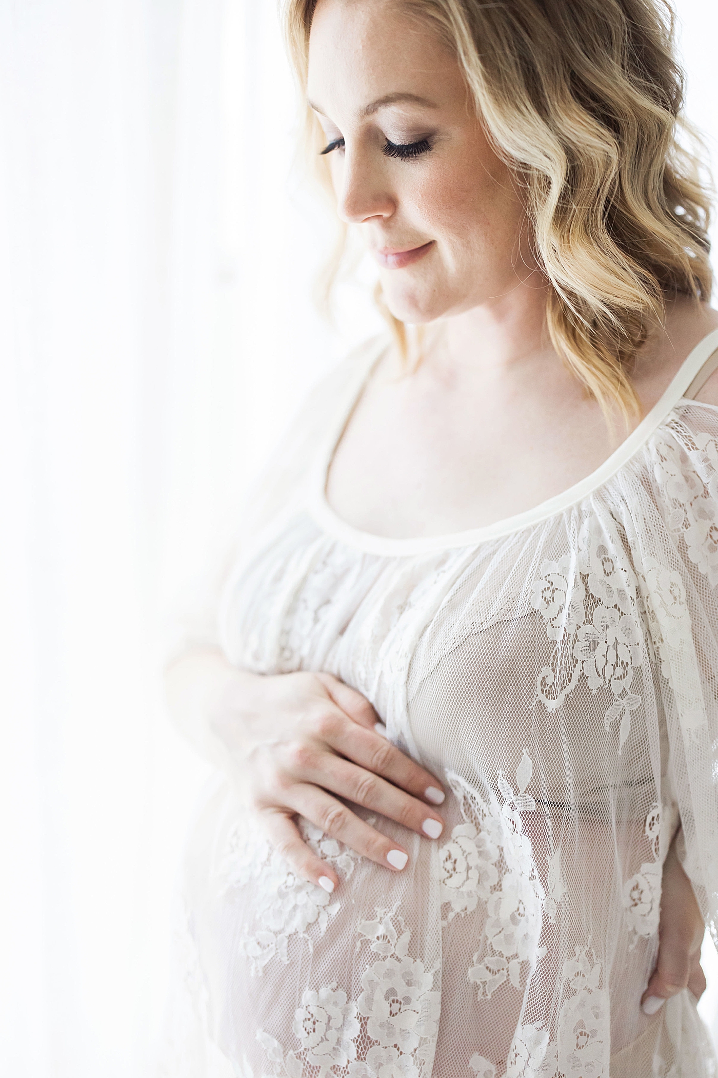 Intimate maternity photos in studio in Houston. Photo by Fresh Light Photography.