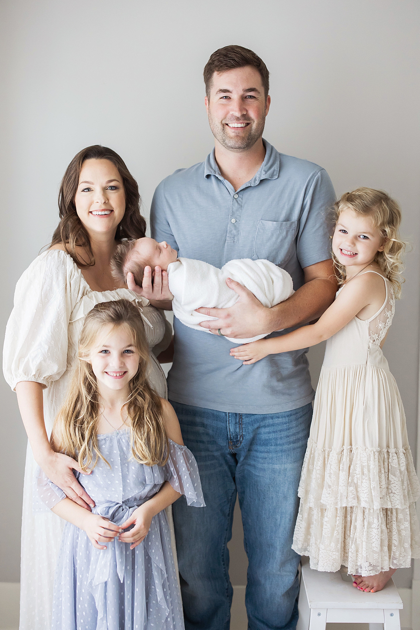 Family of five in studio in The Heights for newborn photos. Photo by Fresh Light Photography.
