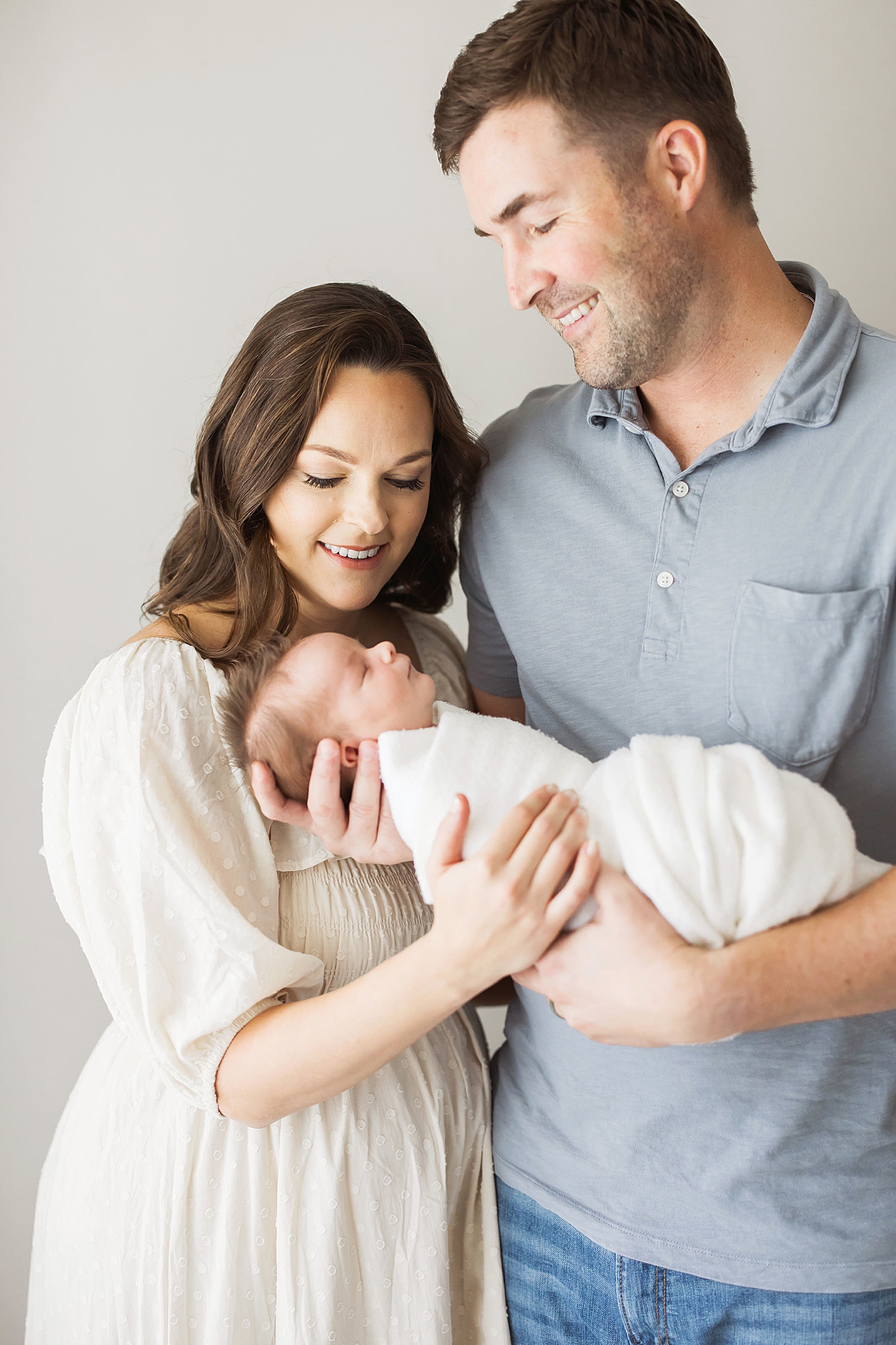 Mom and Dad with their newborn son. Photo by Fresh Light Photography.