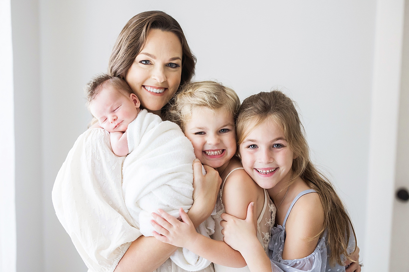 Mom with two daughters and newborn son. Photo by Fresh Light Photography.